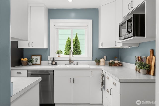 1230 NE 100th St, Seattle, WA 98125 - kitchen with stainless steel appliances, light countertops, white cabinets, and recessed lighting