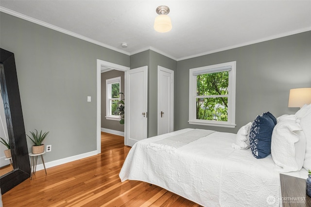 1230 NE 100th St, Seattle, WA 98125 - bedroom with multiple windows, wood finished floors, and ornamental molding