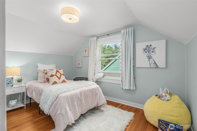 1230 NE 100th St, Seattle, WA 98125 - bedroom with lofted ceiling and wood finished floors
