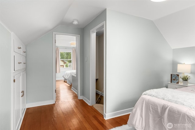 1230 NE 100th St, Seattle, WA 98125 - bedroom featuring lofted ceiling and wood finished floors