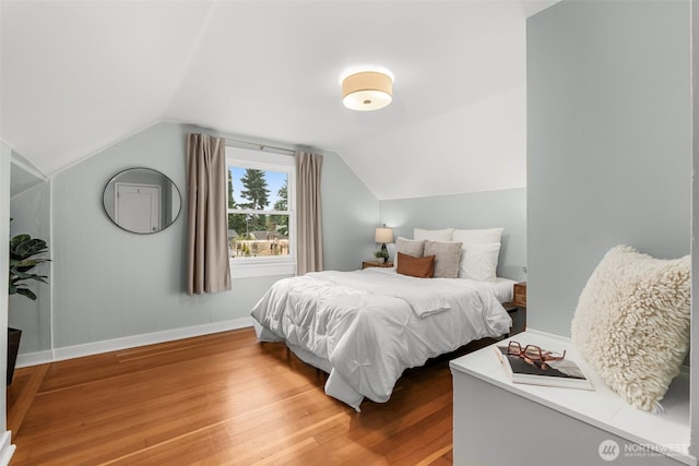 1230 NE 100th St, Seattle, WA 98125 - bedroom with light wood-style floors and lofted ceiling
