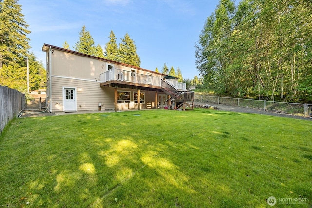 121 E Willapa Rd, Shelton, WA 98584 - back of property featuring a deck, stairway, and a fenced backyard