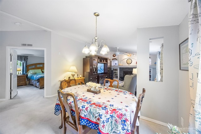 121 E Willapa Rd, Shelton, WA 98584 - carpeted dining room with a chandelier and baseboards