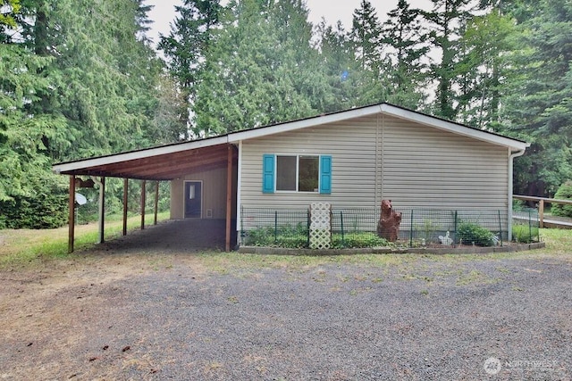140 Fleming Dr, Sequim, WA 98382 - view of side of property with dirt driveway and a carport
