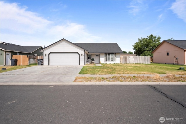 620 N Larkspur, Othello, WA 99344 - ranch-style home with an attached garage and concrete driveway