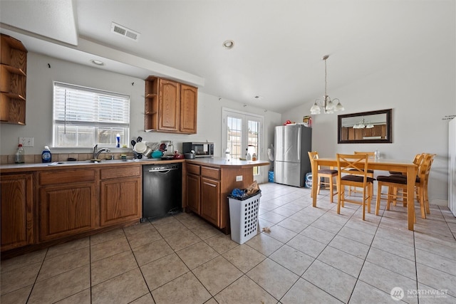 620 N Larkspur, Othello, WA 99344 - kitchen with appliances with stainless steel finishes, open shelves, a peninsula, a chandelier, and vaulted ceiling