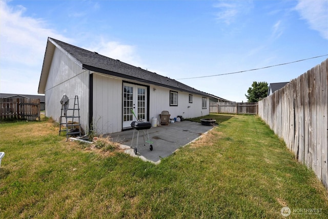 620 N Larkspur, Othello, WA 99344 - rear view of house with french doors, a fenced backyard, and a patio area