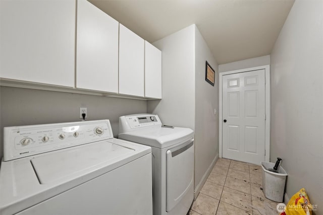 620 N Larkspur, Othello, WA 99344 - laundry area featuring cabinet space, washer and clothes dryer, and light tile patterned floors