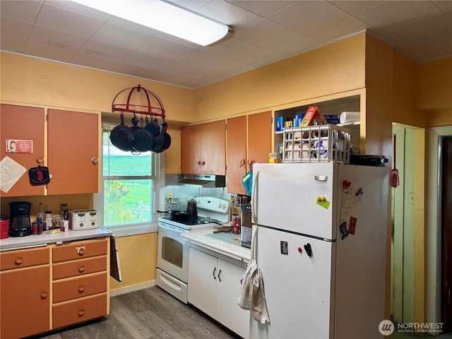 28148 State Route 25 N, Davenport, WA 99122 - kitchen featuring white appliances, exhaust hood, light countertops, wood finished floors, and open shelves