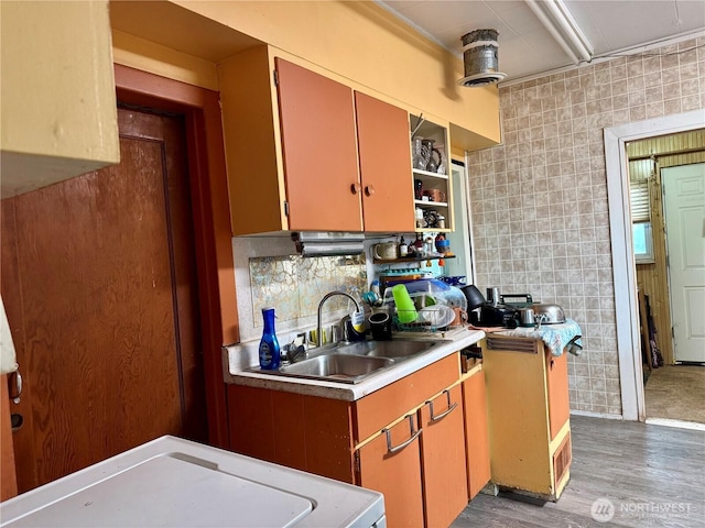 28148 State Route 25 N, Davenport, WA 99122 - kitchen with open shelves, light countertops, light wood-type flooring, and decorative backsplash