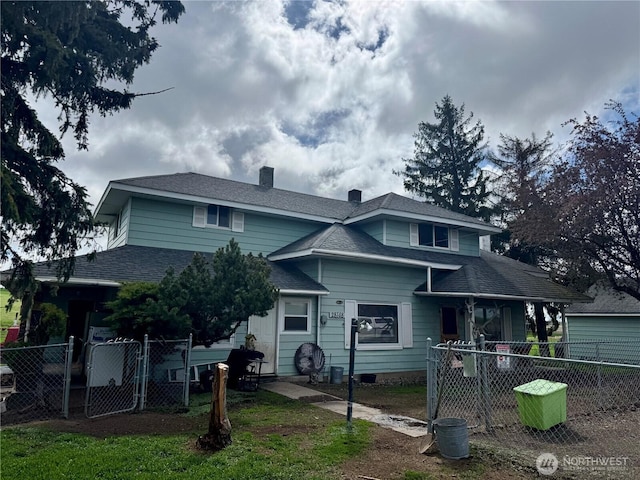 28148 State Route 25 N, Davenport, WA 99122 - view of front facade with a chimney, a gate, and a shingled roof