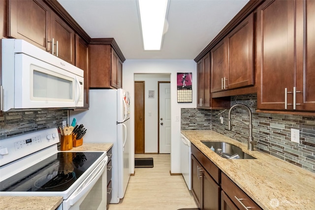 3400 Narrows View Ln NE Unit 204, Bremerton, WA 98310 - kitchen featuring white appliances, light wood finished floors, light stone countertops, and tasteful backsplash