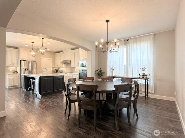 885 N Squire Dr, Ridgefield, WA 98642 - dining space featuring a chandelier, plenty of natural light, and dark wood-type flooring