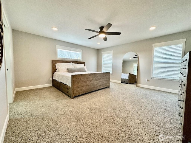 885 N Squire Dr, Ridgefield, WA 98642 - carpeted bedroom featuring arched walkways, recessed lighting, a ceiling fan, and a textured ceiling