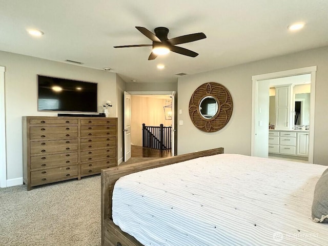 885 N Squire Dr, Ridgefield, WA 98642 - bedroom featuring recessed lighting, connected bathroom, a ceiling fan, and carpet floors