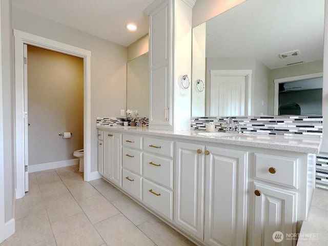 885 N Squire Dr, Ridgefield, WA 98642 - bathroom with double vanity, tasteful backsplash, and tile patterned floors