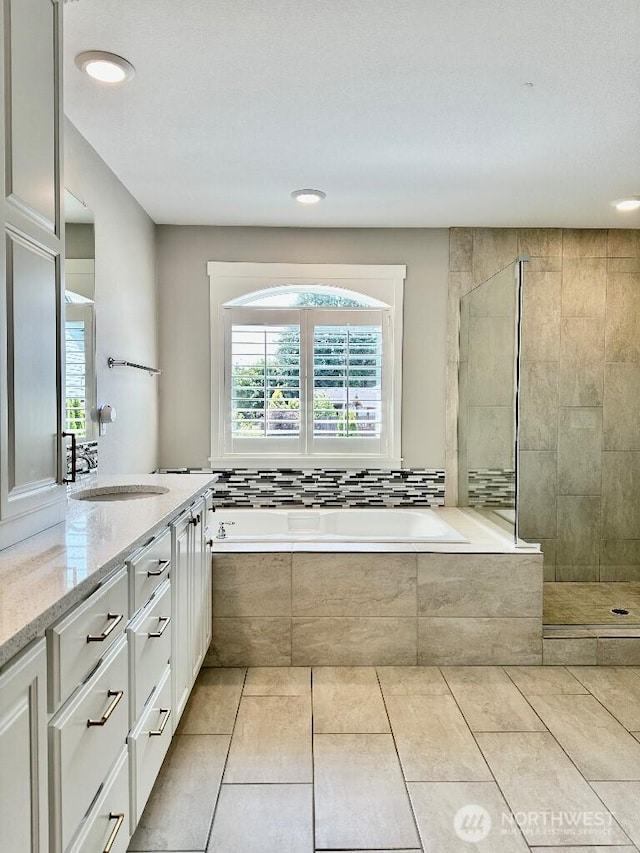 885 N Squire Dr, Ridgefield, WA 98642 - bathroom with a garden tub, vanity, recessed lighting, tiled shower, and tile patterned floors