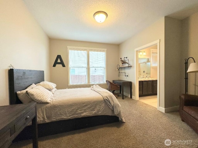 885 N Squire Dr, Ridgefield, WA 98642 - bedroom with carpet flooring, connected bathroom, and a textured ceiling