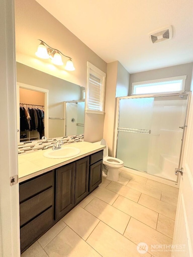 885 N Squire Dr, Ridgefield, WA 98642 - bathroom with a shower stall, vanity, a walk in closet, and tile patterned flooring