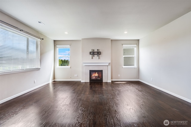 7336 Ashdown Ln SE, Olympia, WA 98513 - unfurnished living room with a tile fireplace, wood finished floors, and recessed lighting