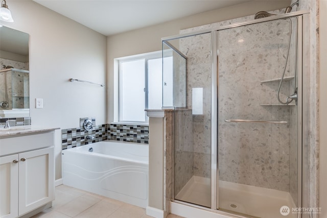 7336 Ashdown Ln SE, Olympia, WA 98513 - full bathroom featuring vanity, tile patterned floors, a garden tub, and a shower stall