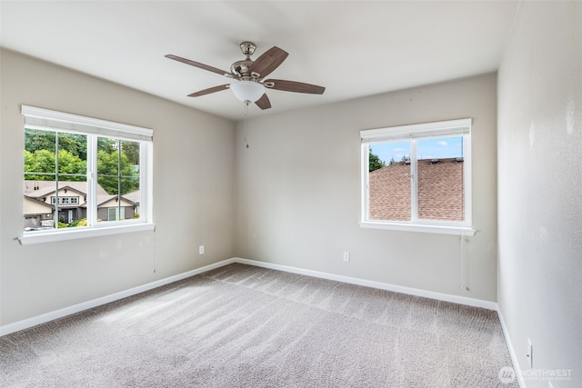 7336 Ashdown Ln SE, Olympia, WA 98513 - carpeted empty room featuring plenty of natural light and ceiling fan