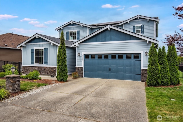 7336 Ashdown Ln SE, Olympia, WA 98513 - view of front of property with stone siding, board and batten siding, and driveway