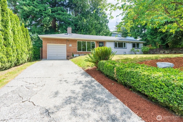 4638 148th Ave SE, Bellevue, WA 98006 - ranch-style home featuring asphalt driveway, a garage, a chimney, brick siding, and a front lawn