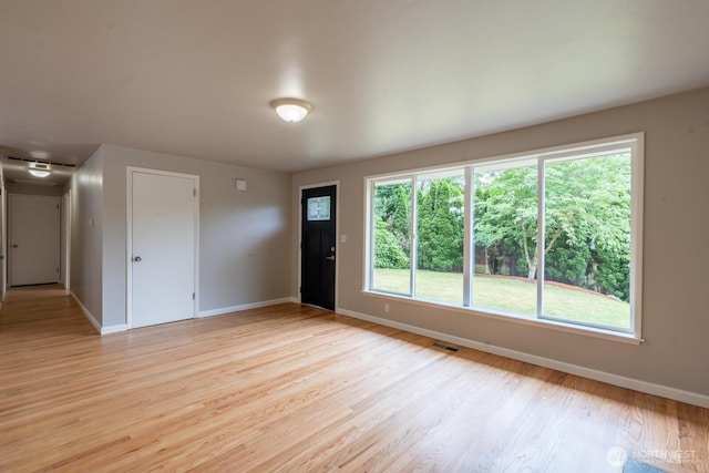 4638 148th Ave SE, Bellevue, WA 98006 - spare room featuring baseboards and light wood-type flooring