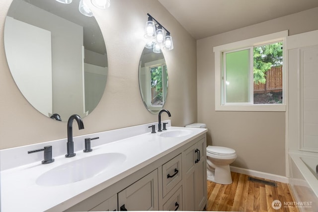 4638 148th Ave SE, Bellevue, WA 98006 - full bathroom with double vanity and wood finished floors