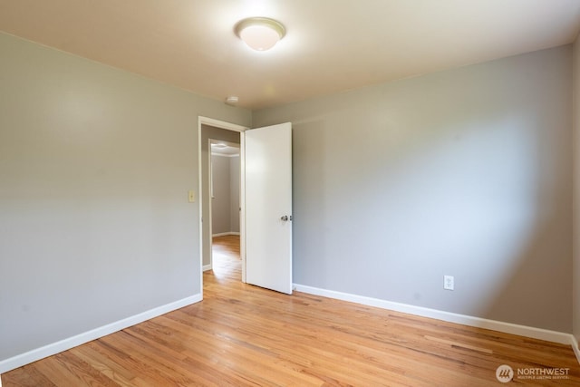 4638 148th Ave SE, Bellevue, WA 98006 - empty room featuring light wood-style floors and a smoke detector