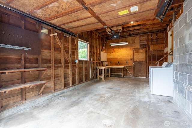 4638 148th Ave SE, Bellevue, WA 98006 - garage featuring washing machine and clothes dryer, a garage door opener, and concrete block wall