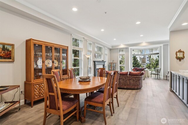 520 6th Ave Unit 2001, Kirkland, WA 98033 - dining room with light wood-style floors, recessed lighting, a fireplace, and crown molding