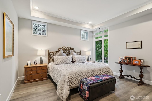 520 6th Ave Unit 2001, Kirkland, WA 98033 - bedroom featuring a tray ceiling, ornamental molding, light wood-style floors, and recessed lighting