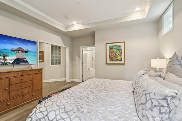 520 6th Ave Unit 2001, Kirkland, WA 98033 - bedroom with crown molding, wood finished floors, a raised ceiling, ensuite bath, and recessed lighting