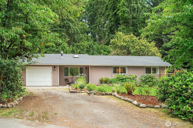 18304 Mclean Rd SW, Vashon, WA 98070 - ranch-style home with driveway, an attached garage, and a shingled roof
