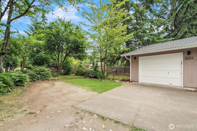 18304 Mclean Rd SW, Vashon, WA 98070 - view of yard with driveway and a garage