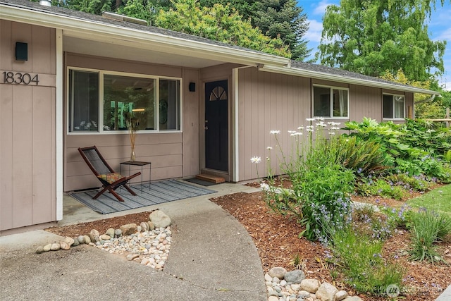 18304 Mclean Rd SW, Vashon, WA 98070 - doorway to property with a shingled roof