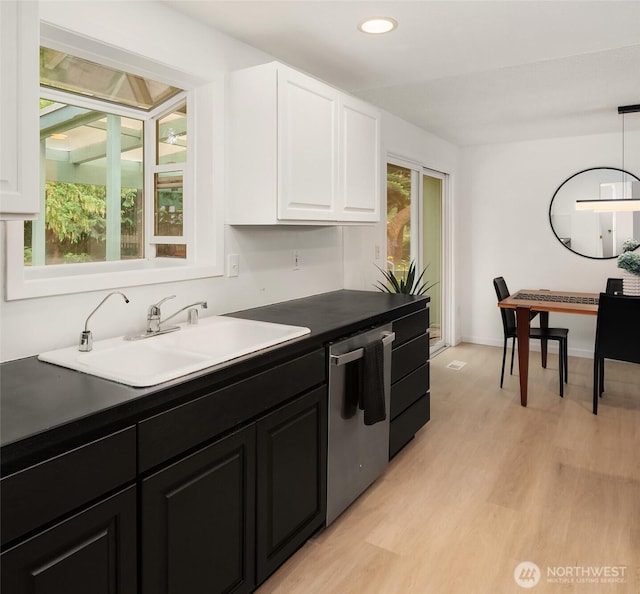 18304 Mclean Rd SW, Vashon, WA 98070 - kitchen featuring dishwasher, white cabinets, dark cabinets, dark countertops, and recessed lighting
