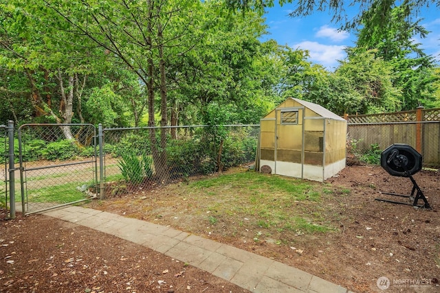 18304 Mclean Rd SW, Vashon, WA 98070 - view of yard featuring an exterior structure, a gate, and an outbuilding