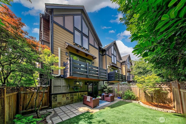 4314 Linden Ave N, Seattle, WA 98103 - back of property featuring a fenced backyard and a patio area