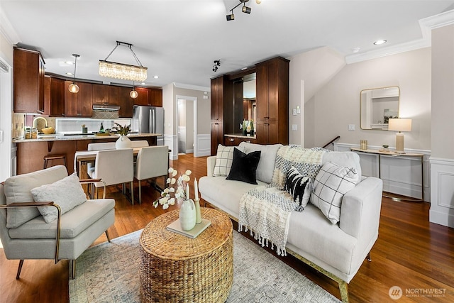 4314 Linden Ave N, Seattle, WA 98103 - living room with crown molding, wainscoting, recessed lighting, and wood finished floors