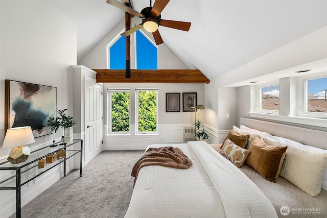 4314 Linden Ave N, Seattle, WA 98103 - bedroom featuring carpet floors, wainscoting, multiple windows, and high vaulted ceiling