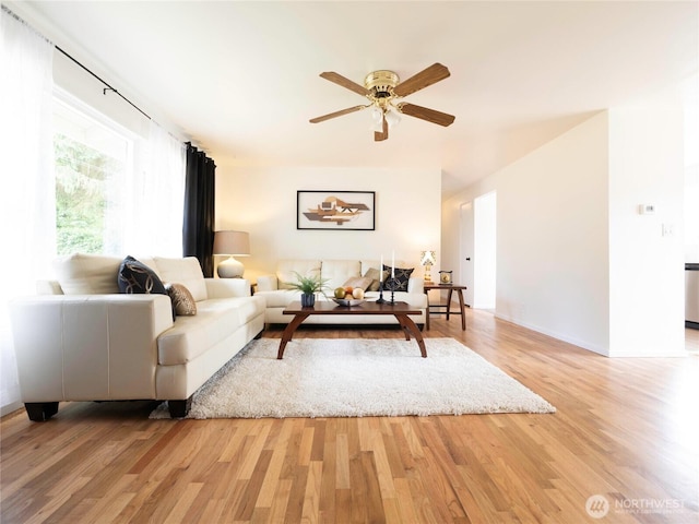 18111 46th Ave S, Seatac, WA 98188 - living room with light wood finished floors and a ceiling fan