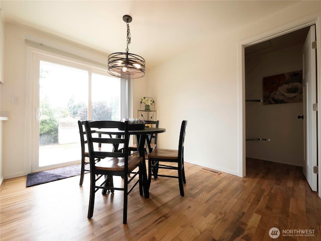 18111 46th Ave S, Seatac, WA 98188 - dining space with wood finished floors and a chandelier