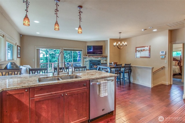 211 Geer Ln, Orcas Island, WA 98245 - kitchen featuring dishwasher, dark wood-type flooring, pendant lighting, light stone countertops, and recessed lighting
