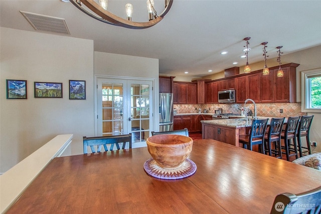 211 Geer Ln, Orcas Island, WA 98245 - dining space featuring french doors and recessed lighting