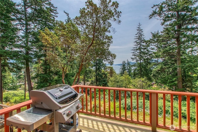 211 Geer Ln, Orcas Island, WA 98245 - wooden terrace with grilling area and a wooded view
