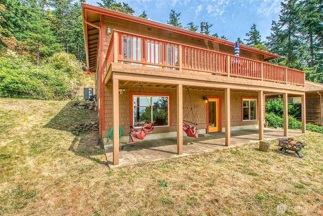 211 Geer Ln, Orcas Island, WA 98245 - rear view of property featuring a patio, a fire pit, and a yard
