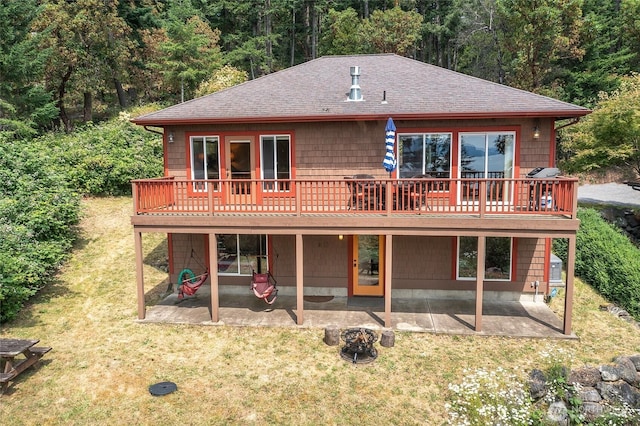211 Geer Ln, Orcas Island, WA 98245 - back of property with a patio area, a shingled roof, a lawn, and a deck